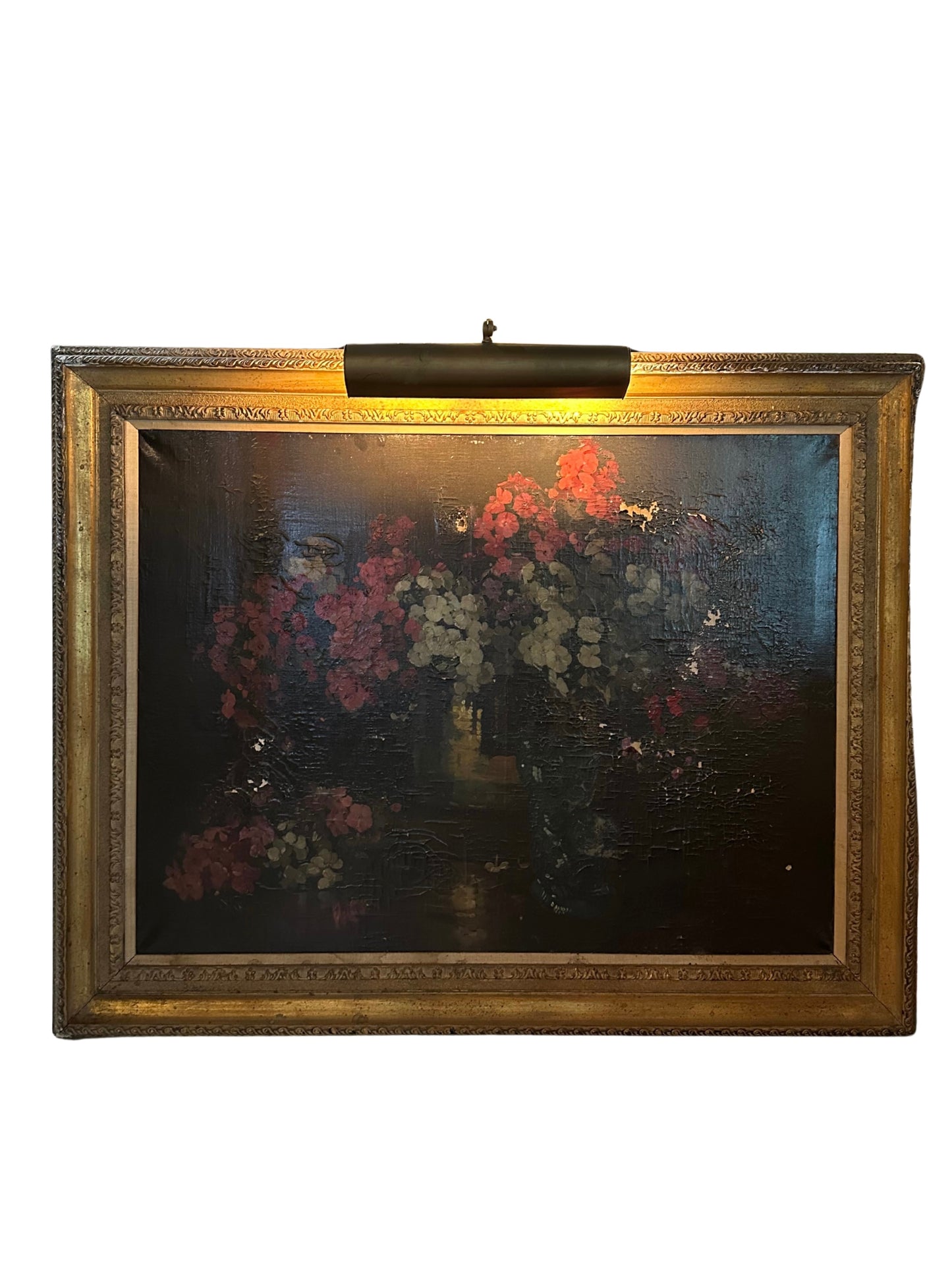 The Big Framed Painting with Light features a dimly lit floral arrangement in rich reds, whites, and pinks within an ornate gold frame, illuminated by an integrated picture light above the artwork.