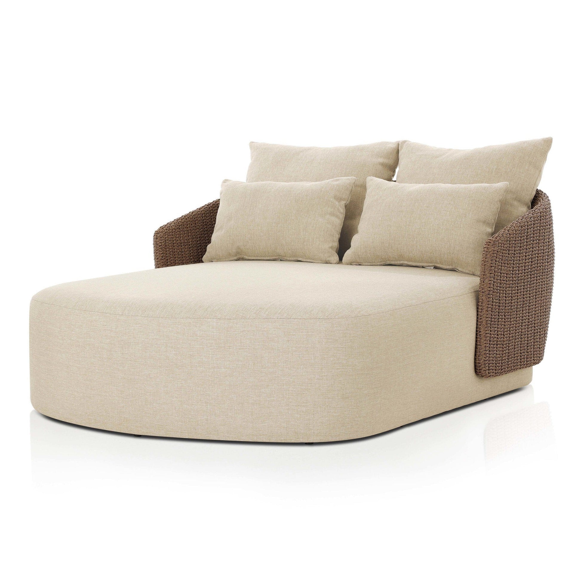 The Maven Outdoor Double Chaise is a modern, beige upholstered lounge with brown woven armrests, three large back cushions, and two accent pillows. Its size perfectly complements a twin bed frame and is shown against a white background.