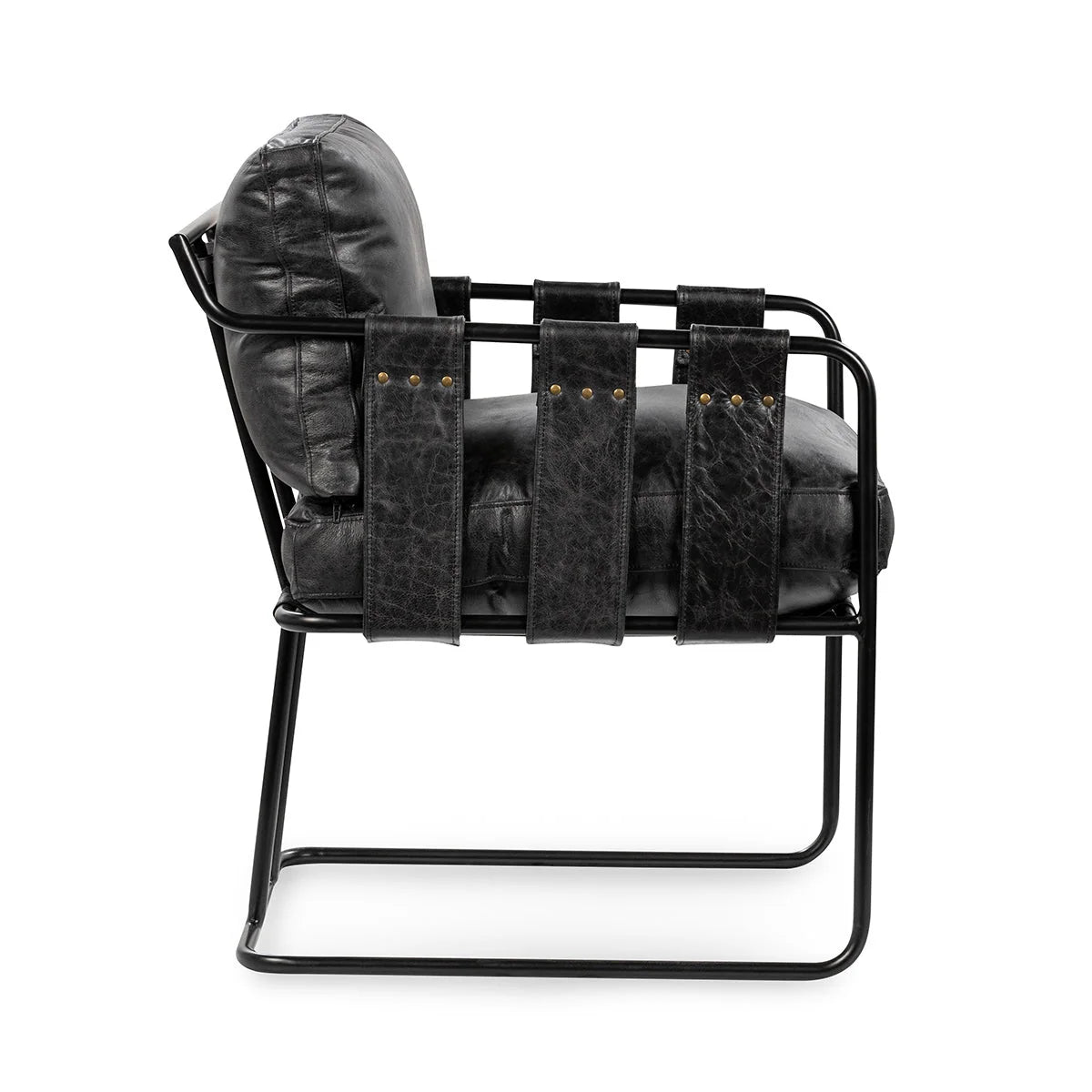 Side view of the Strap Dining Chair, a modern black leather chair with a metal frame and leather straps, measuring 21.5″W x 26.5″D x 32″H, supporting the seat and back cushion.