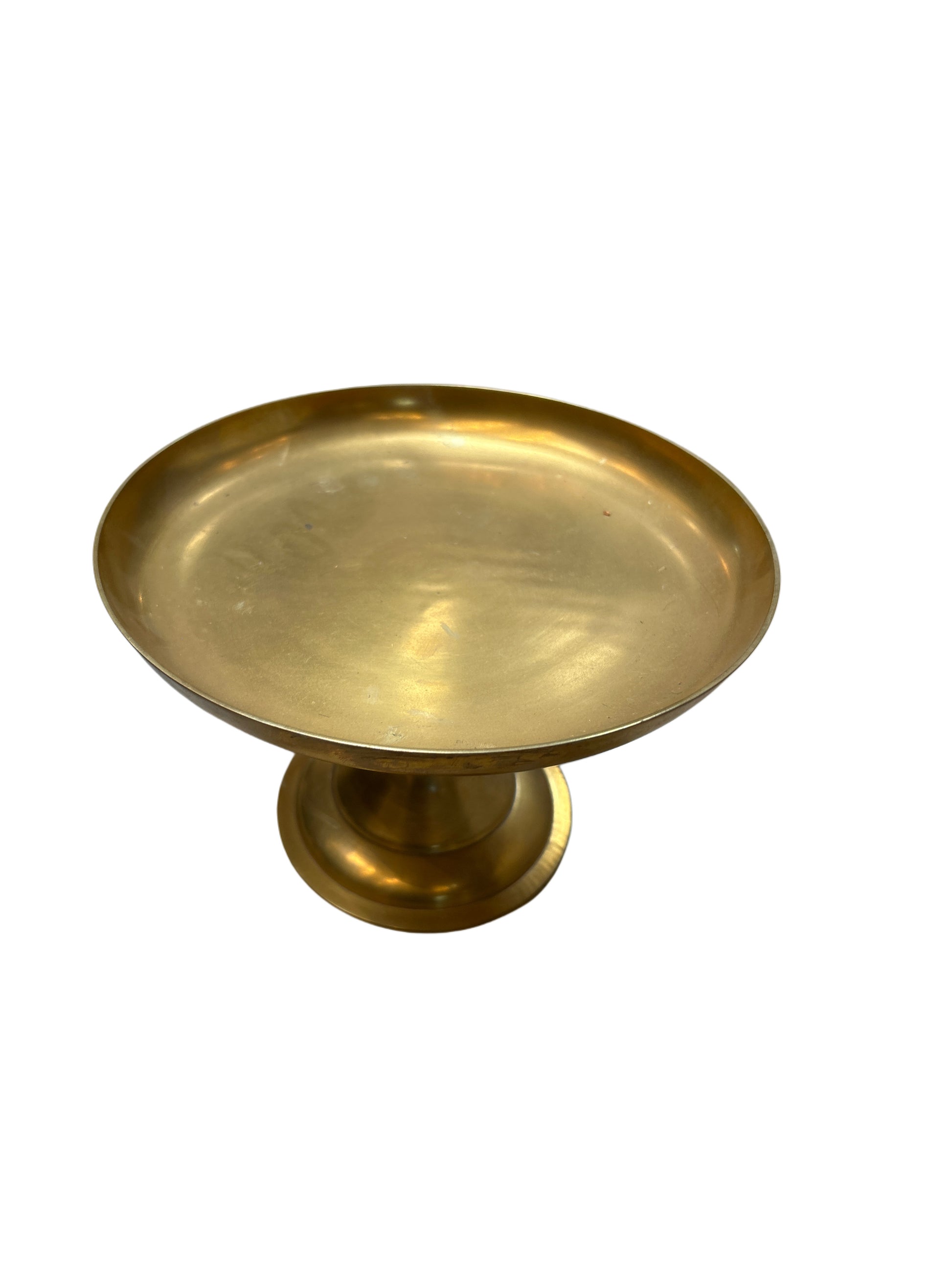 The Brass Cake Plate features a shiny brass finish with a wide, shallow bowl and round pedestal base, shown against a plain white background.
