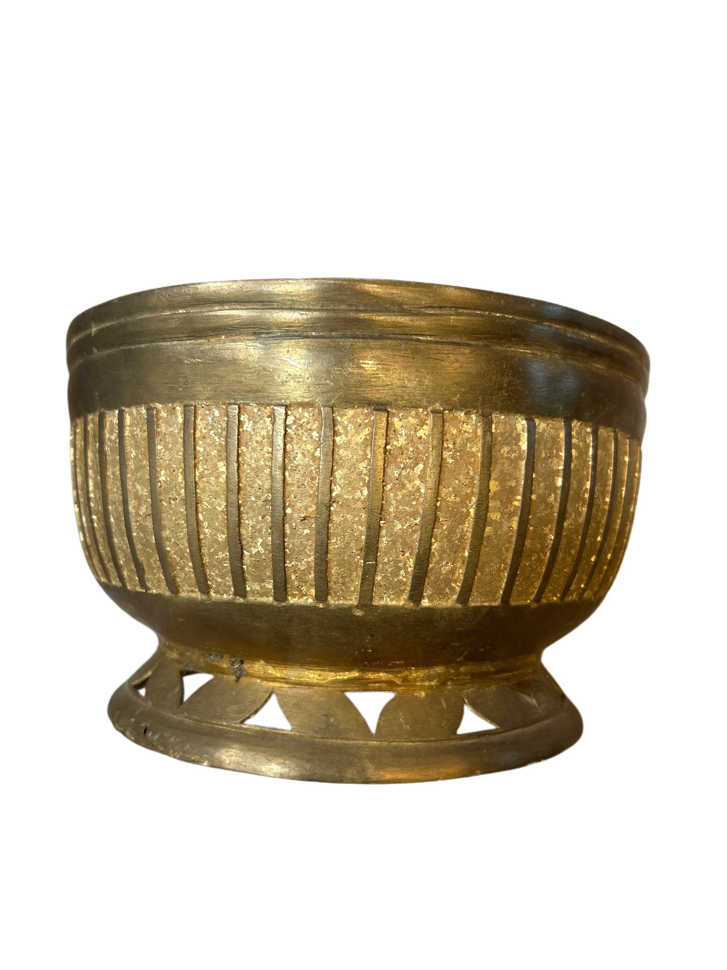 The Decorative Brass Bowl is round with vertical ridges, a shiny textured gold finish, and an openwork circular base.