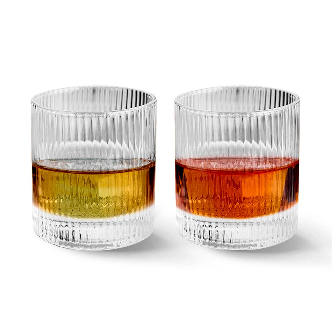 Two Vintage Straight Line Tumblers (10 oz each) are filled with golden yellow and deep amber liquids and set side by side against a plain white background.