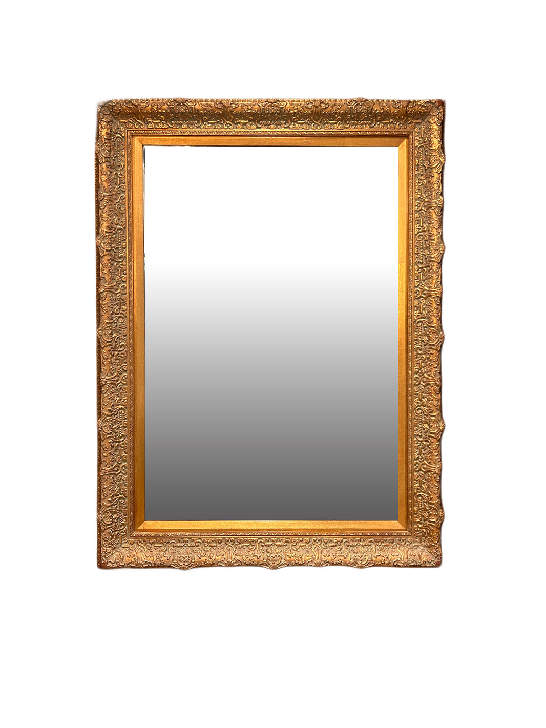 The Vintage Beveled Gilt Frame Mirror is a rectangular wall mirror with an ornate gold wood frame, intricate gilt detailing, and a subtle gradient reflection, shown against a plain white background.