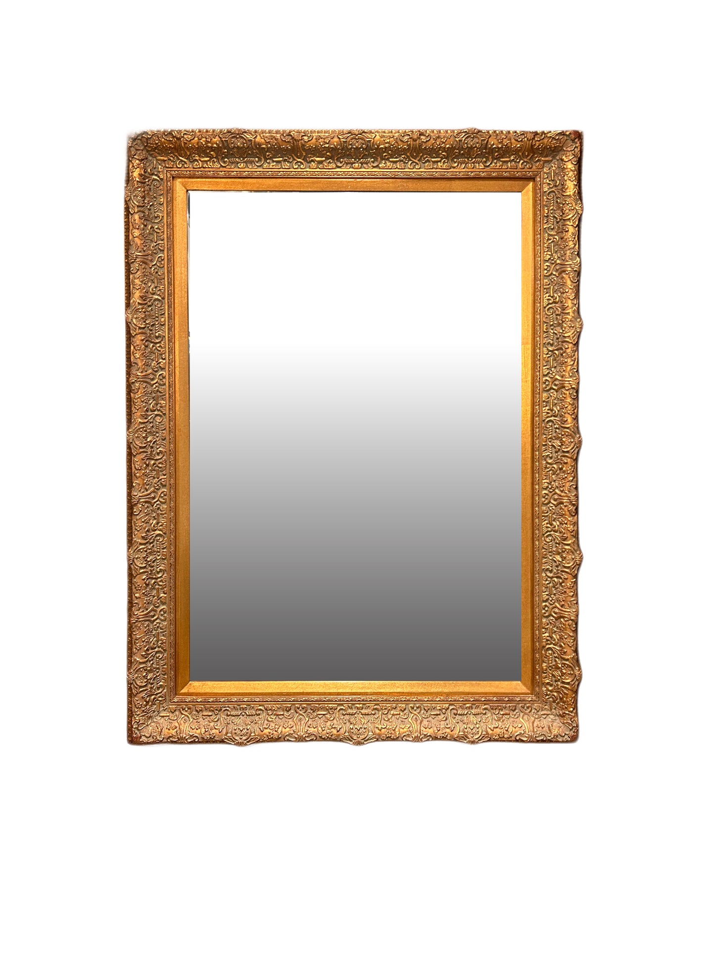 The Vintage Beveled Gilt Frame Mirror is a rectangular wall mirror with an ornate gold wood frame, intricate gilt detailing, and a subtle gradient reflection, shown against a plain white background.