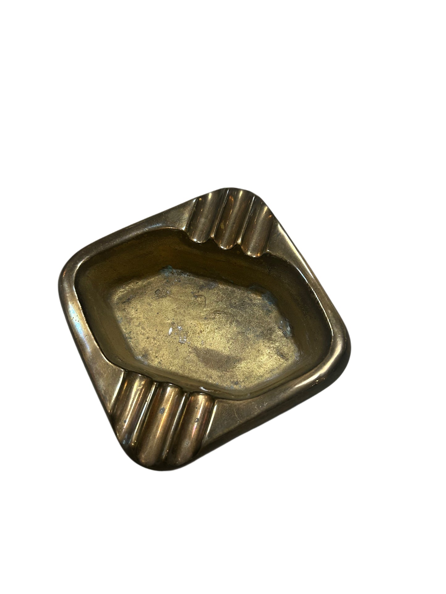 The Vintage Brass Ashtray has a rectangular shape with rounded edges and three grooved rests on one side, displayed on a white background.