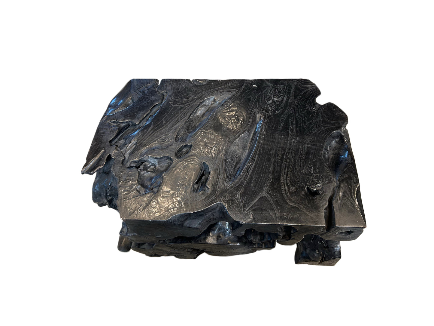 The EBONIZED OLD GROWTH TEAK STUMP is a dark, glossy, irregular chunk with textured swirls and rough edges, resembling volcanic rock or a large wood block against a white background.