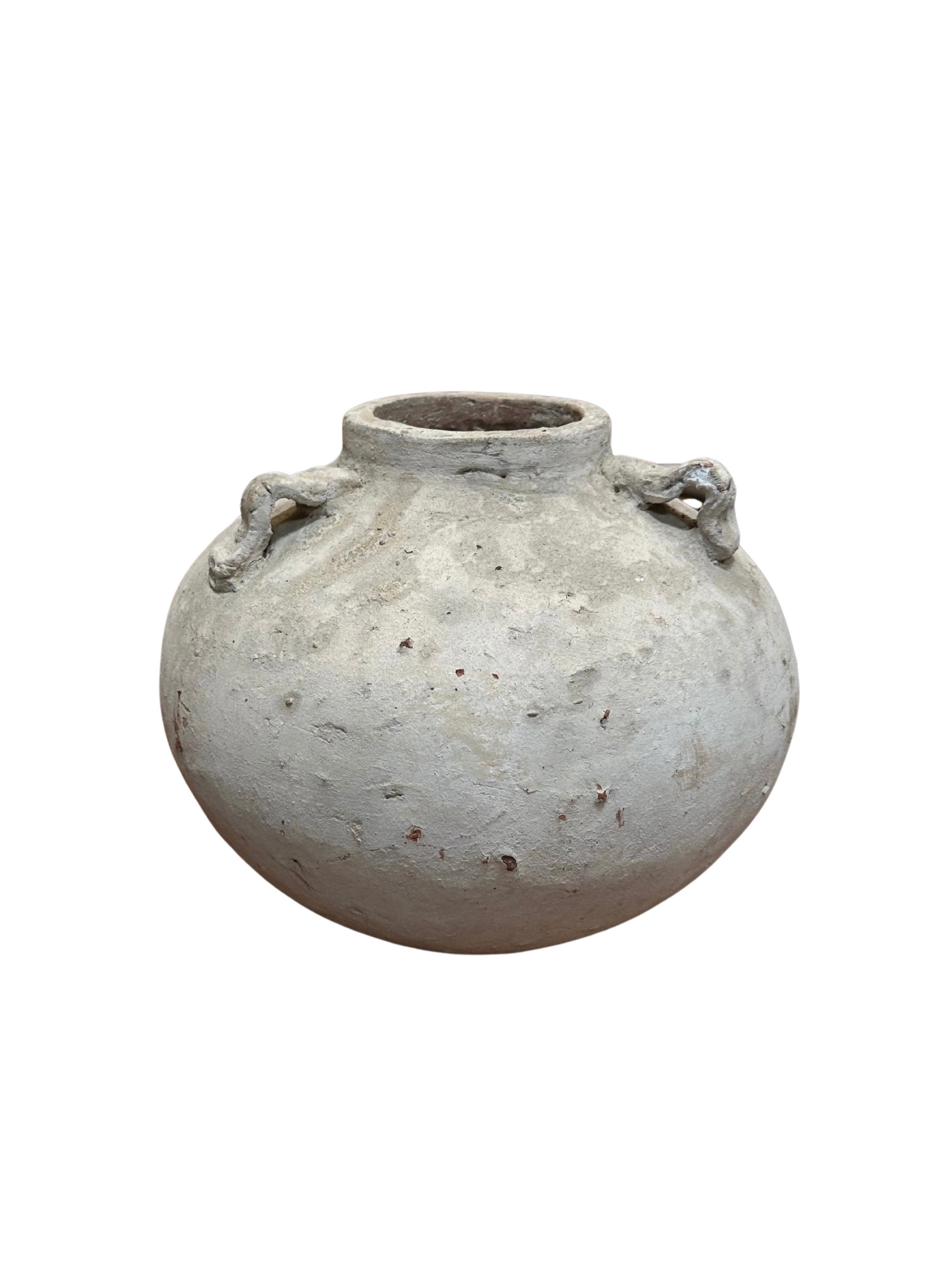 The Round Terracotta Vase - White is a weathered, off-white decorative pot with a wide mouth and two loop handles, ideal as a 9-inch indoor planter.