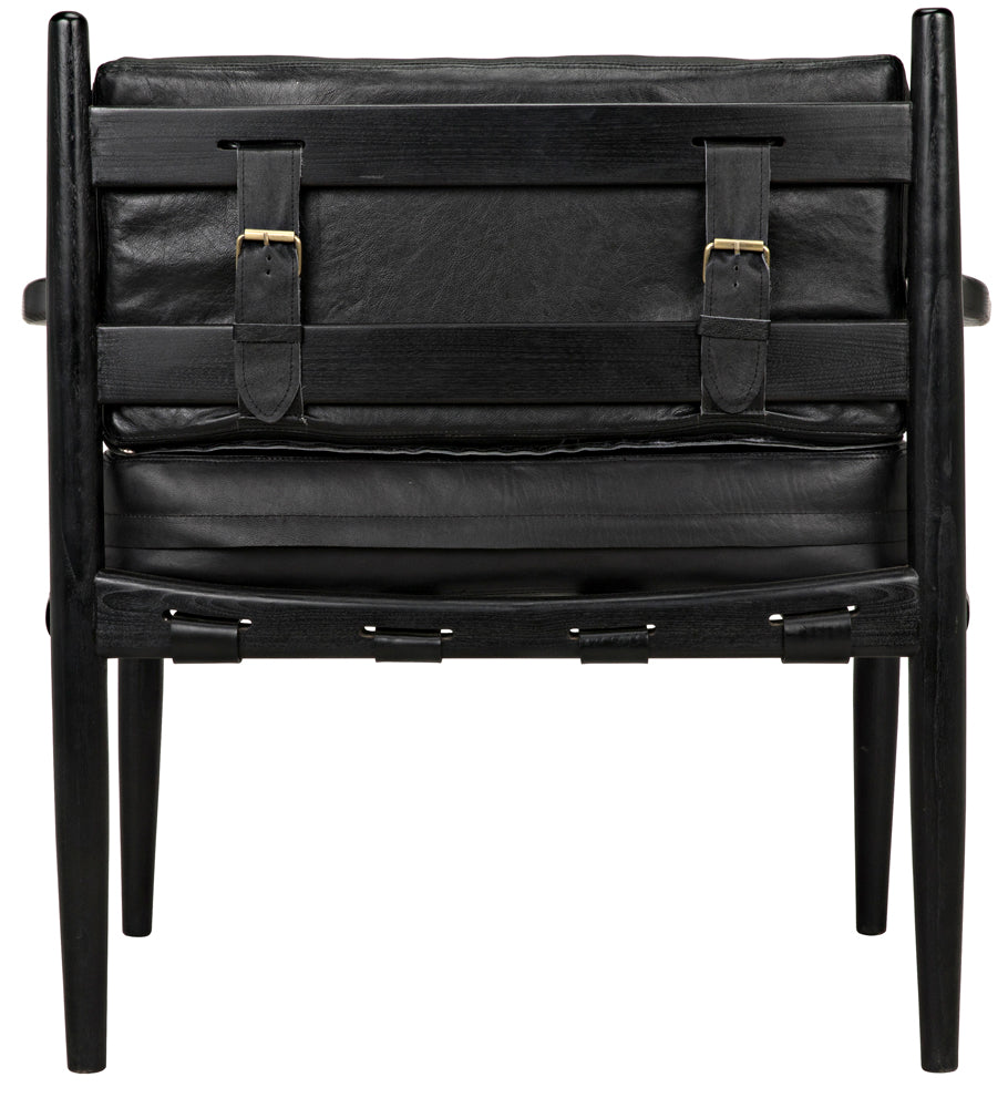 The Fogel Lounge Chair in charcoal black features a modern design with a leather finish, wooden legs and frame, visible straps, and buckle detailing on the backrest.