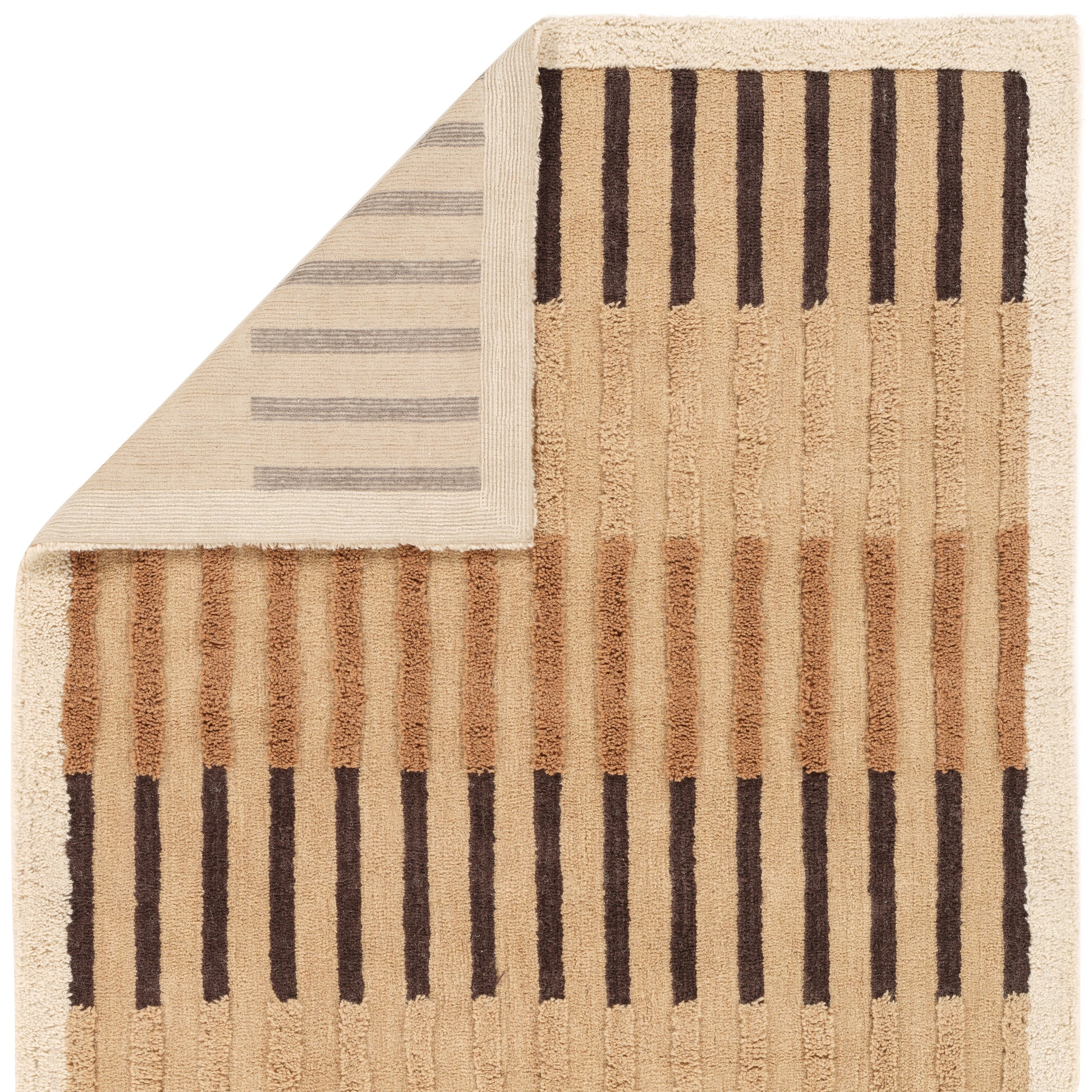 The Abstract Modern Handwoven 105 | Rug features a beige background with vertical brown stripes and a folded corner revealing horizontal gray stripes underneath. This hand-loomed wool rug adds a subtle, serene touch to any space.