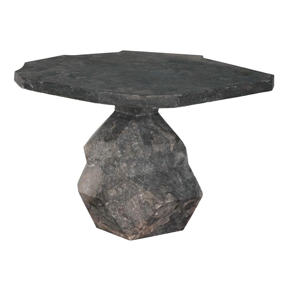 The Rind Table, Black Marble features a modern, dark gray stone design with an irregular hexagonal top and faceted pedestal base. Its sleek look makes it perfect as stylish decor for any contemporary space. Set against a plain white background.