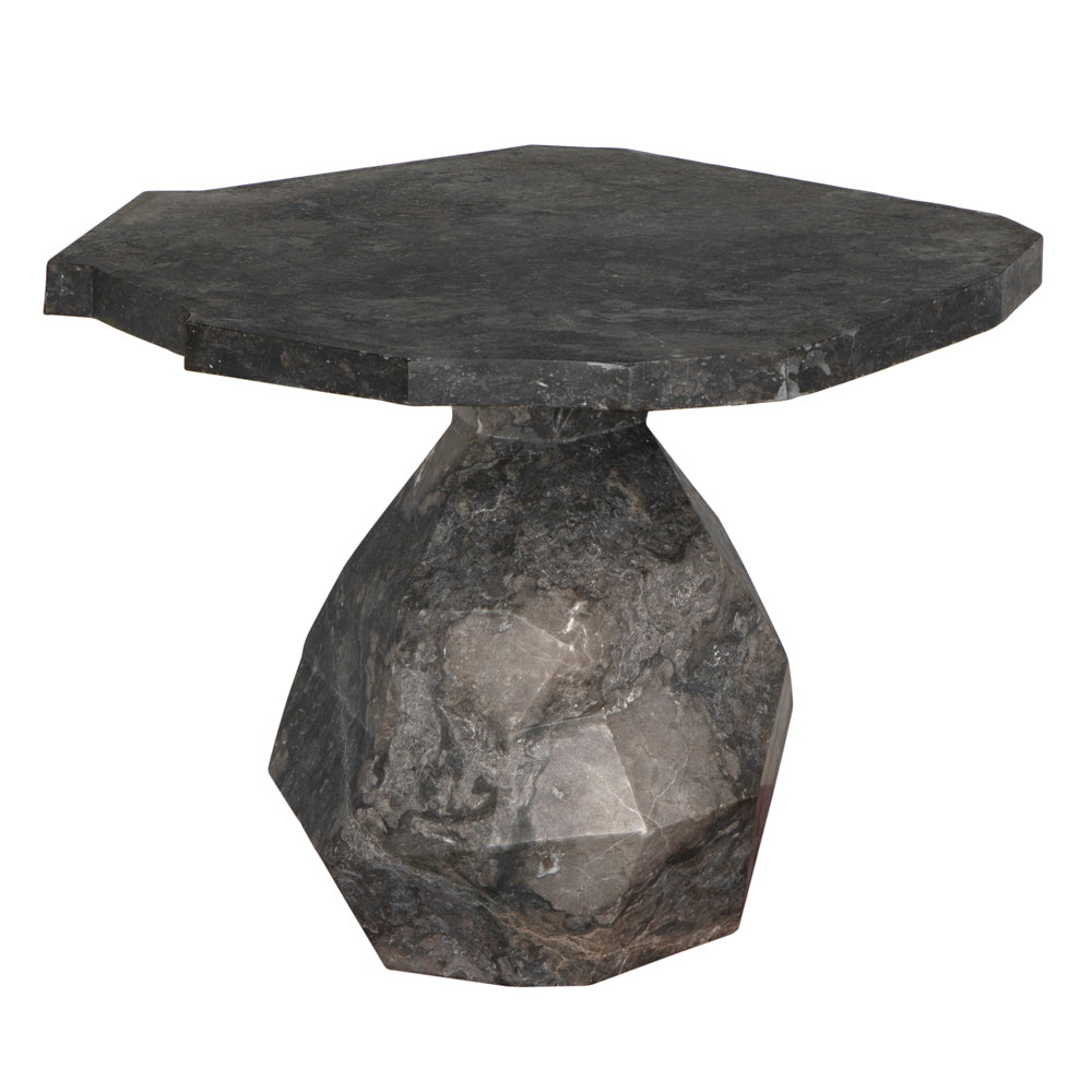 The Rind Table in Black Marble features a modern, irregular geometric top and a faceted, sculptural base—making it a striking accent piece for any space.