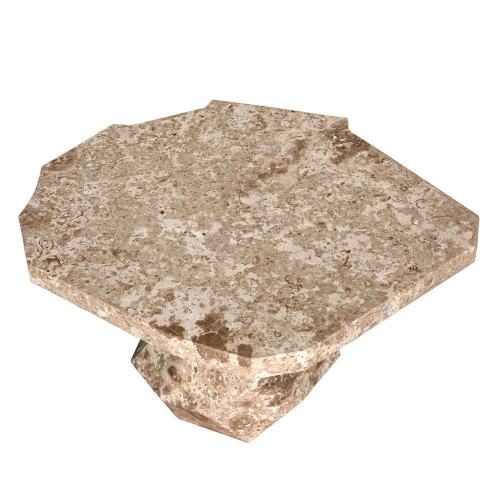 The Rind Table features a hexagonal shape with a wide, flat top and sturdy base in white marble. Its beveled edges and solid geometric design make it perfect for a contemporary or modern interior.