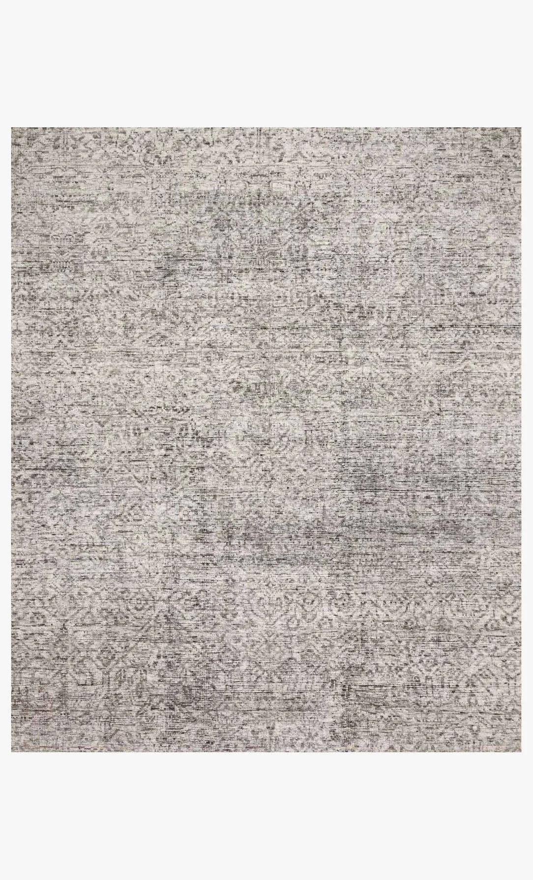 A close-up of the Faded Multi Color Rug 8x10 shows its hand-knotted wool texture and subtle, intricate patterns in gray tones, creating a slightly distressed and textured look.