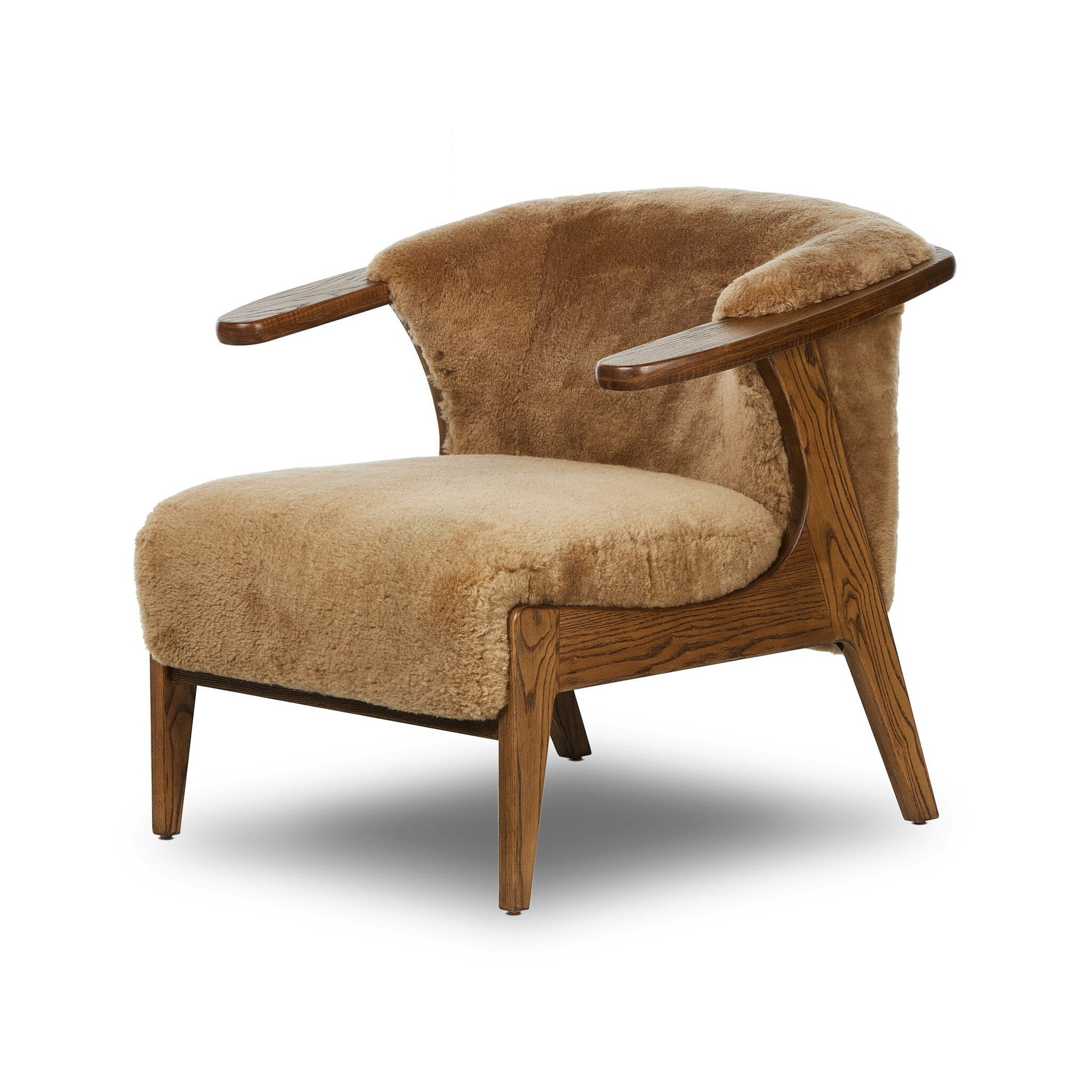 The Fabian Chair features plush tan upholstery, wooden legs and armrests, and a smoothly curved backrest. Its compact size and cozy design make this modern chair an inviting addition to any room.