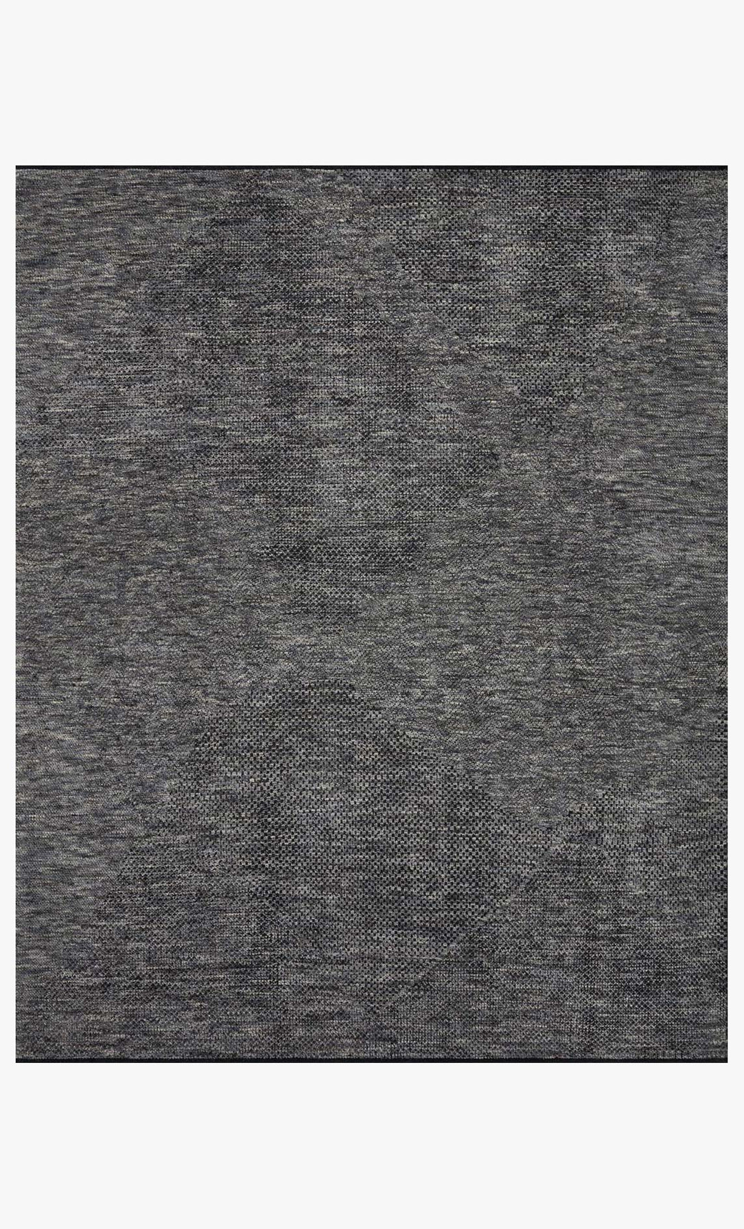 A close-up of the Demin Wool Rug 8 x 10 shows a gray, textured wool surface with a fine weave pattern. The material is soft with slight variations in shade and texture. Available in multiple sizes.