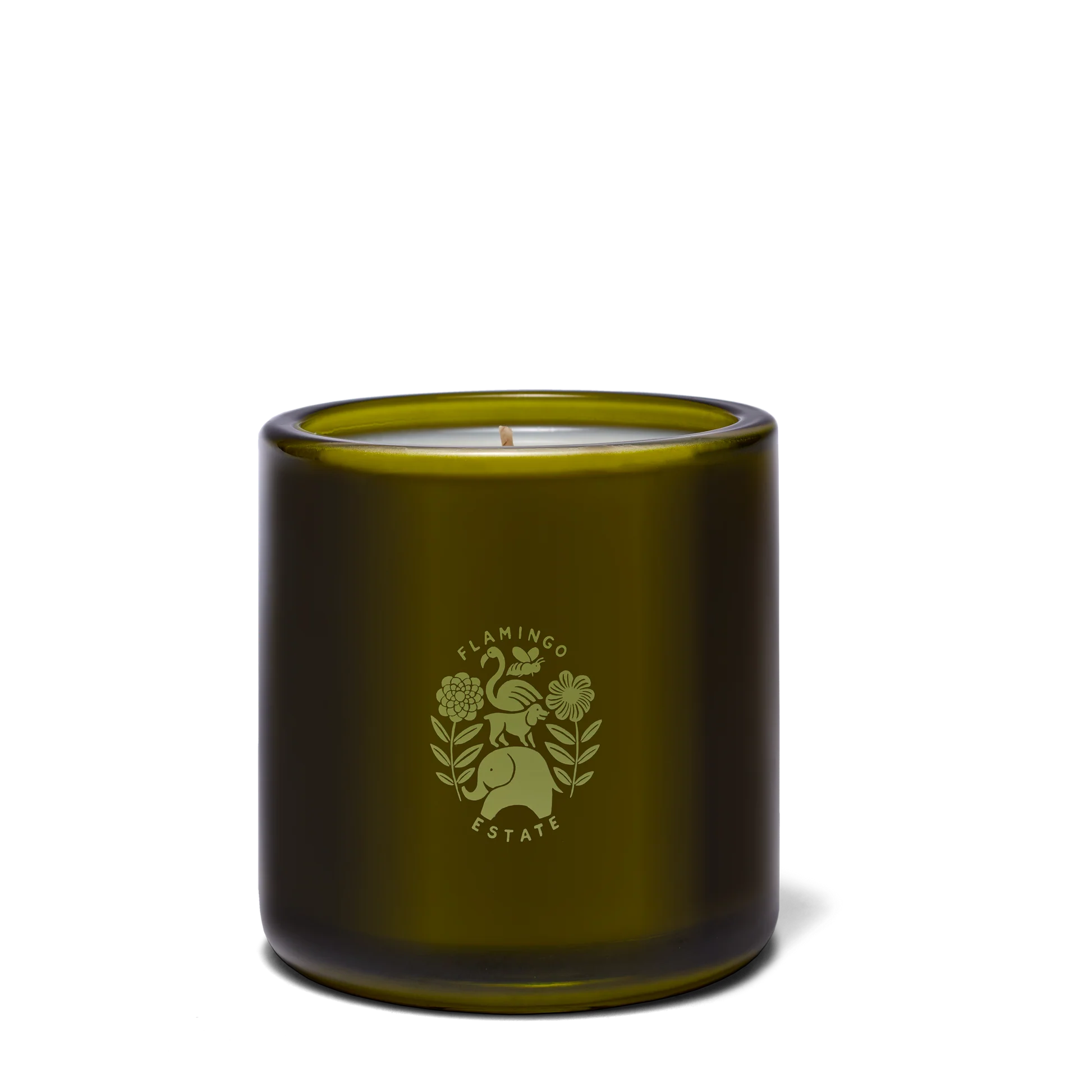 A green glass jar candle from Flamingo Estate with white wax and a logo of a flamingo, pear, flowers, and leaves. The label features Night Blooming Jasmine & Damask Rose scents.