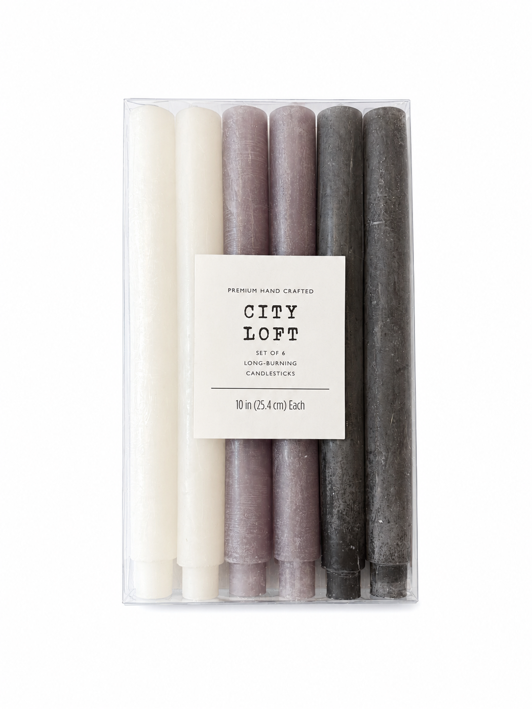 A clear box contains the Premium Candlestick Set - 6 Pack, featuring six 10 inch (25.4 cm) hand-crafted candlesticks in elegant shades of white, lavender, and gray. A central label reads: City Loft, set of 6, 10 in (25.4 cm) each, premium hand crafted, long-burning ivory and lavender candlesticks.