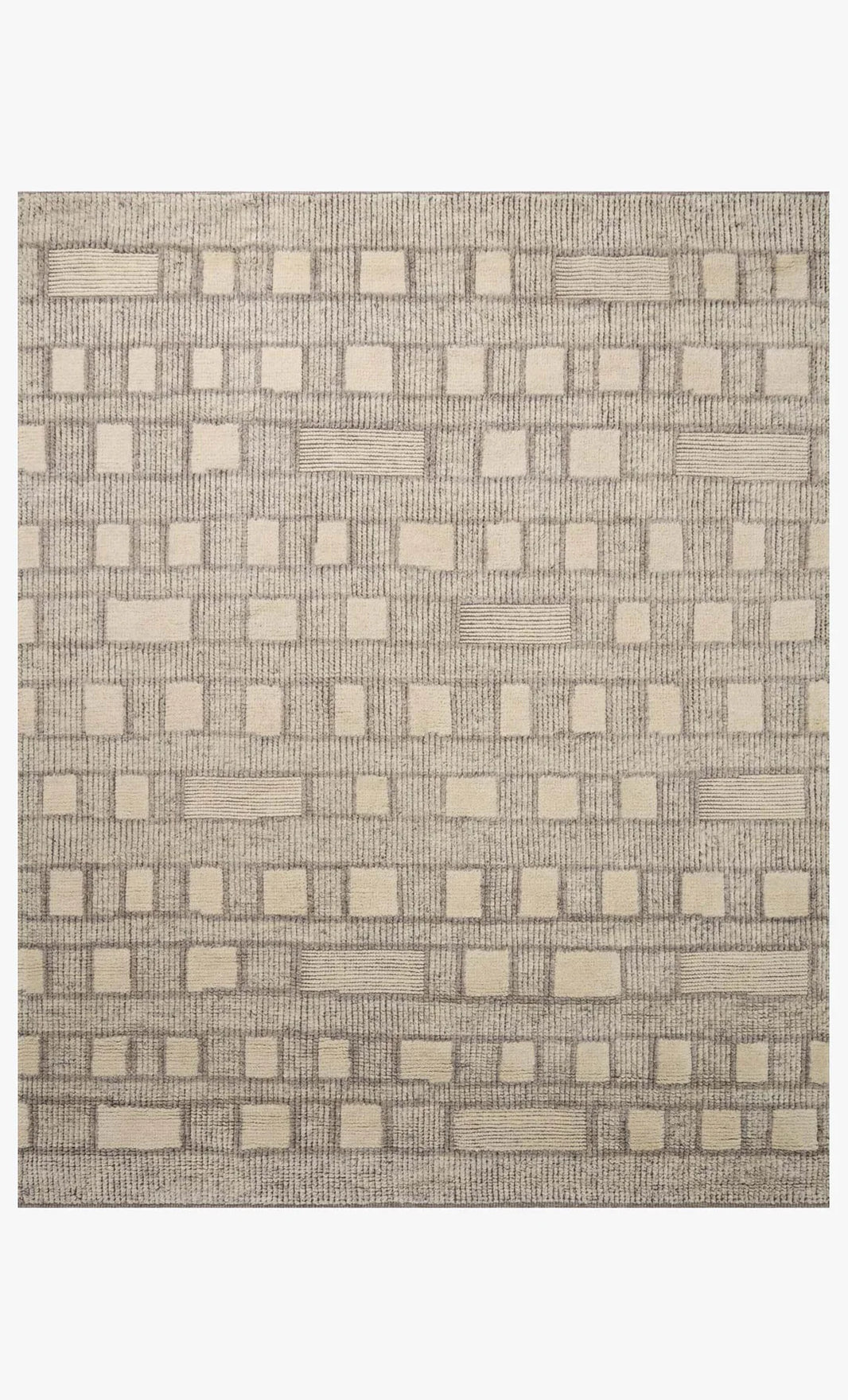 The Indian Wool Tribal Rug (8'6" x 11'6") features a beige and light brown geometric pattern with textured raised squares. Made from 100% wool, it's available in multiple sizes.
