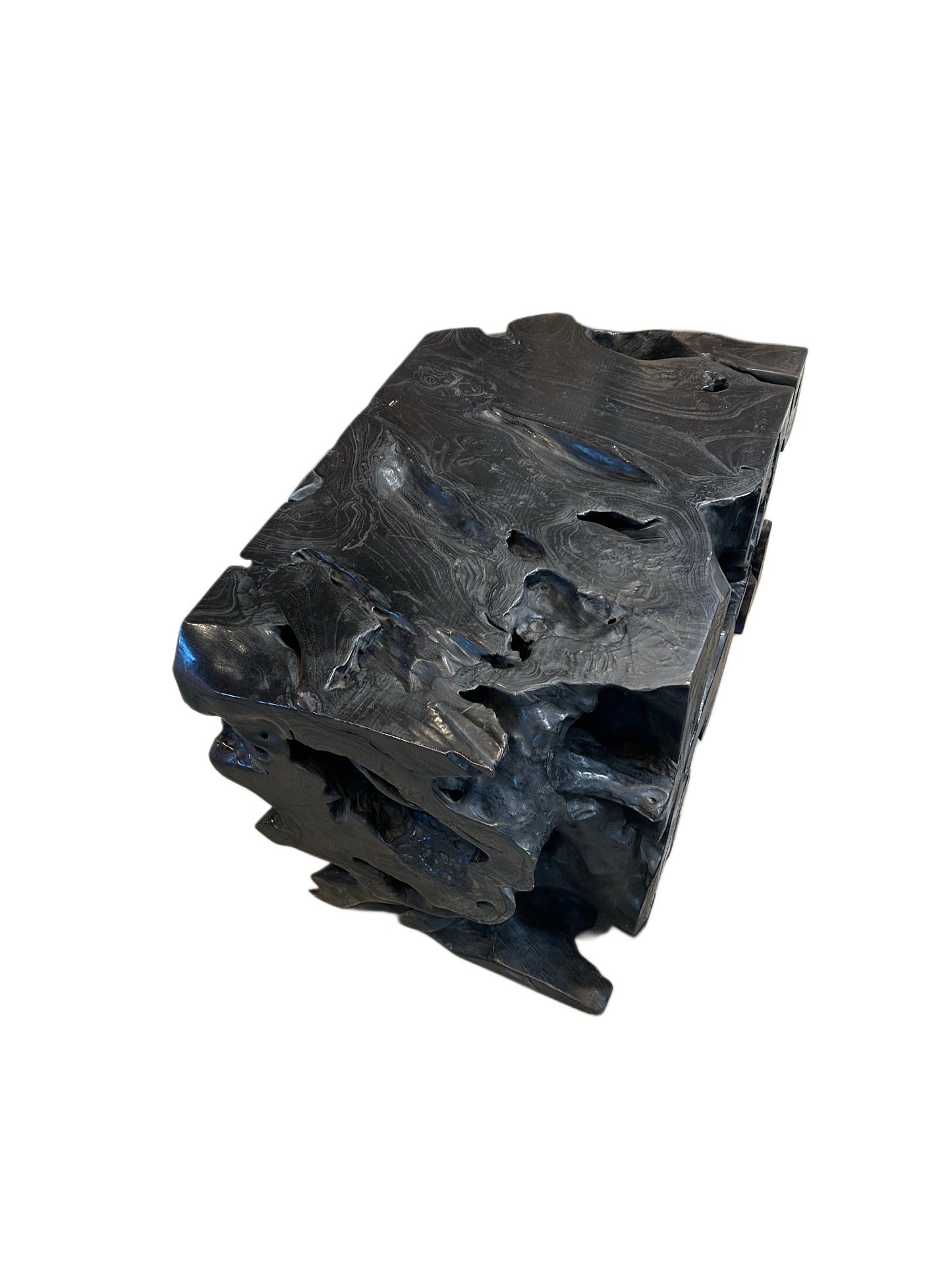 The EBONIZED OLD GROWTH TEAK STUMP is a large, sculpted black wood block with an abstract, rugged texture and irregular surface, resembling natural driftwood or a carved stump, set against a white background.
