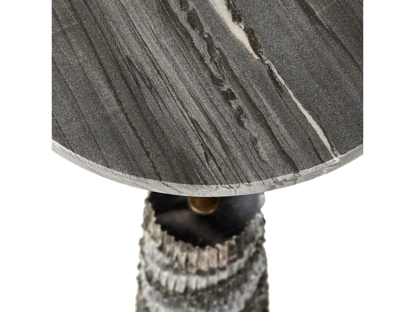 A close-up of the Raven End Table highlights its textured, dark gray stone top with natural white and black veining, elegantly supported by a ridged stone pedestal. Measuring 12″W x 12″D x 22.25″H, this table brings a refined touch to any space while showcasing its elegant, compact proportions.