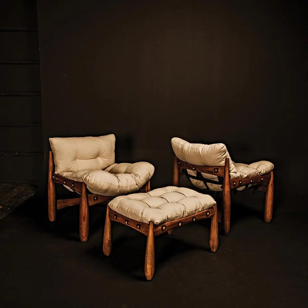 Three Dante Hammock Accent Chairs with plush beige cushions and wooden frames are arranged against a plain black background. One chair, measuring 30W X 32D X 34H, is paired with a matching ottoman.