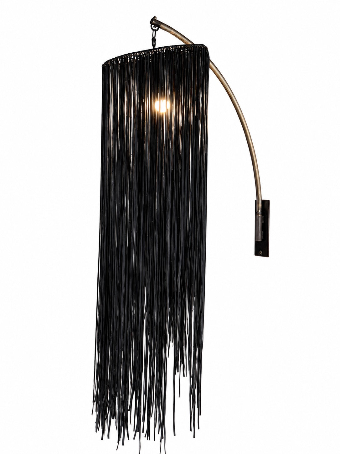The Vintage Vegan Leather Fringe Sconce features a curved metal arm and black vegan leather fringe strands that partially obscure the bulb, offering an elegant accent for your home lighting ensemble against a crisp white background.