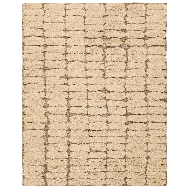 The Handwoven Jute and Wool Rug is a rectangular beige area rug with a textured surface and an irregular brown grid pattern, resembling hand-drawn lines. Perfect in 8' x 10' size to add warmth and style to your space.