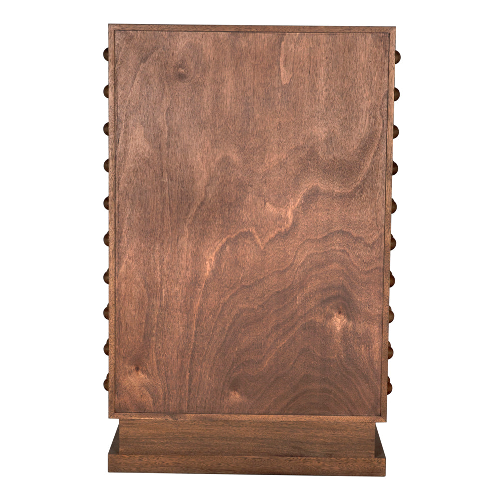 The Didier Cabinet in Dark Walnut features a smooth, natural-grain rectangular panel standing vertically on a matching base, with sides adorned by evenly spaced small rounded pegs—reminiscent of classic walnut cabinetry.