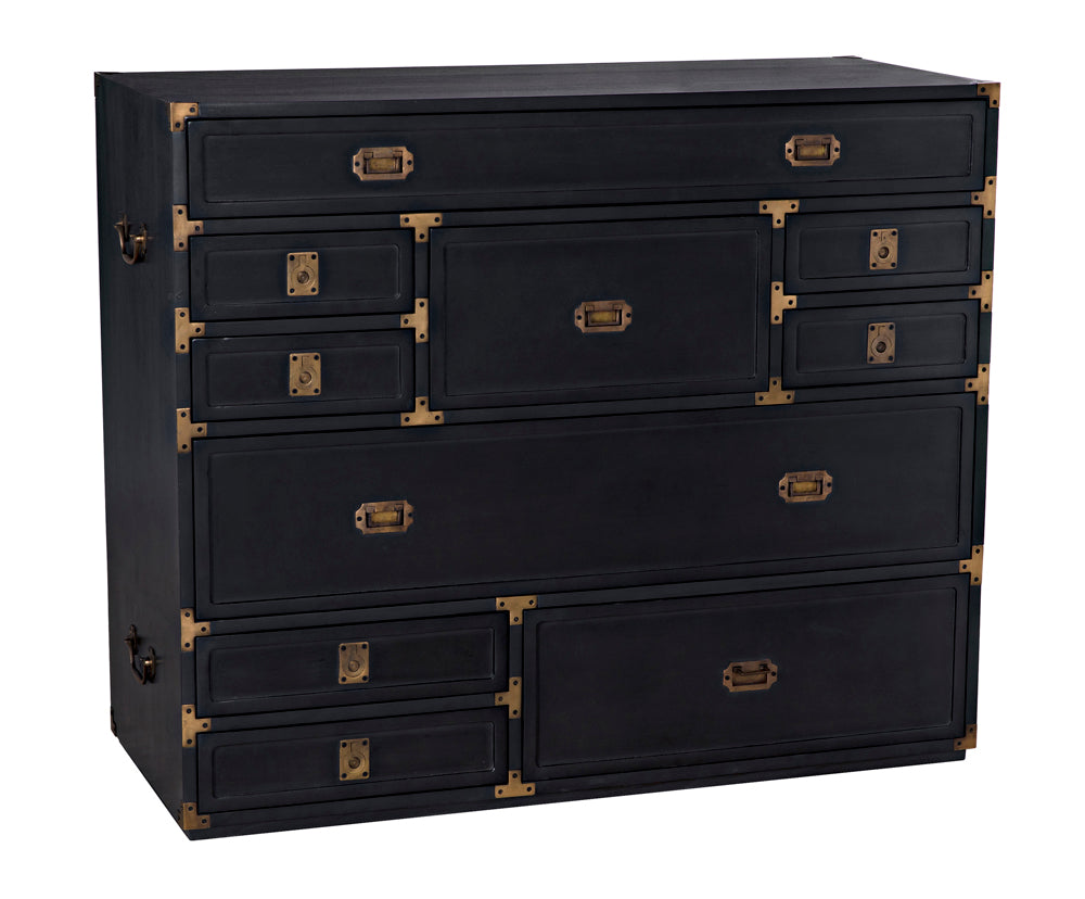 The Charles Chest, Pale is a hardwood chest with multiple drawers of varying sizes and brass handles, arranged asymmetrically.