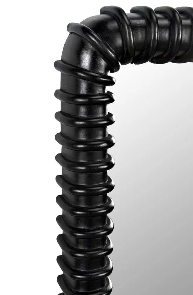 Close-up of the corner of the Sculpted Mahogany Mirror, showcasing its thick, glossy black ribbed spiral frame. This large wall art (26.5"W x 3"D x 37"H) adds elegance to your space as a standout piece of dimensions wall decor.
