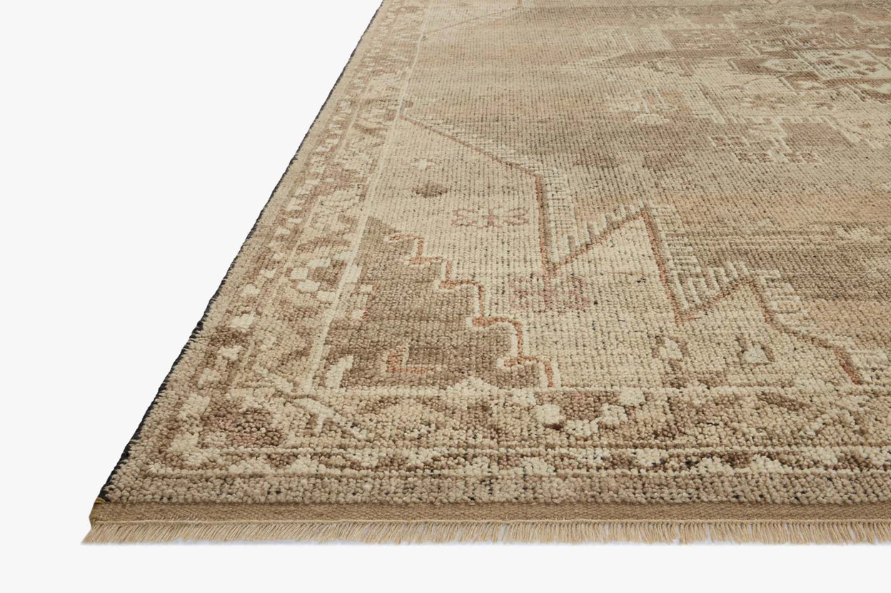 A close-up of the Low Pile Turkish Rug - 8'6x11'6 shows its beige and tan geometric pattern with fringe on a white background; available in various sizes.
