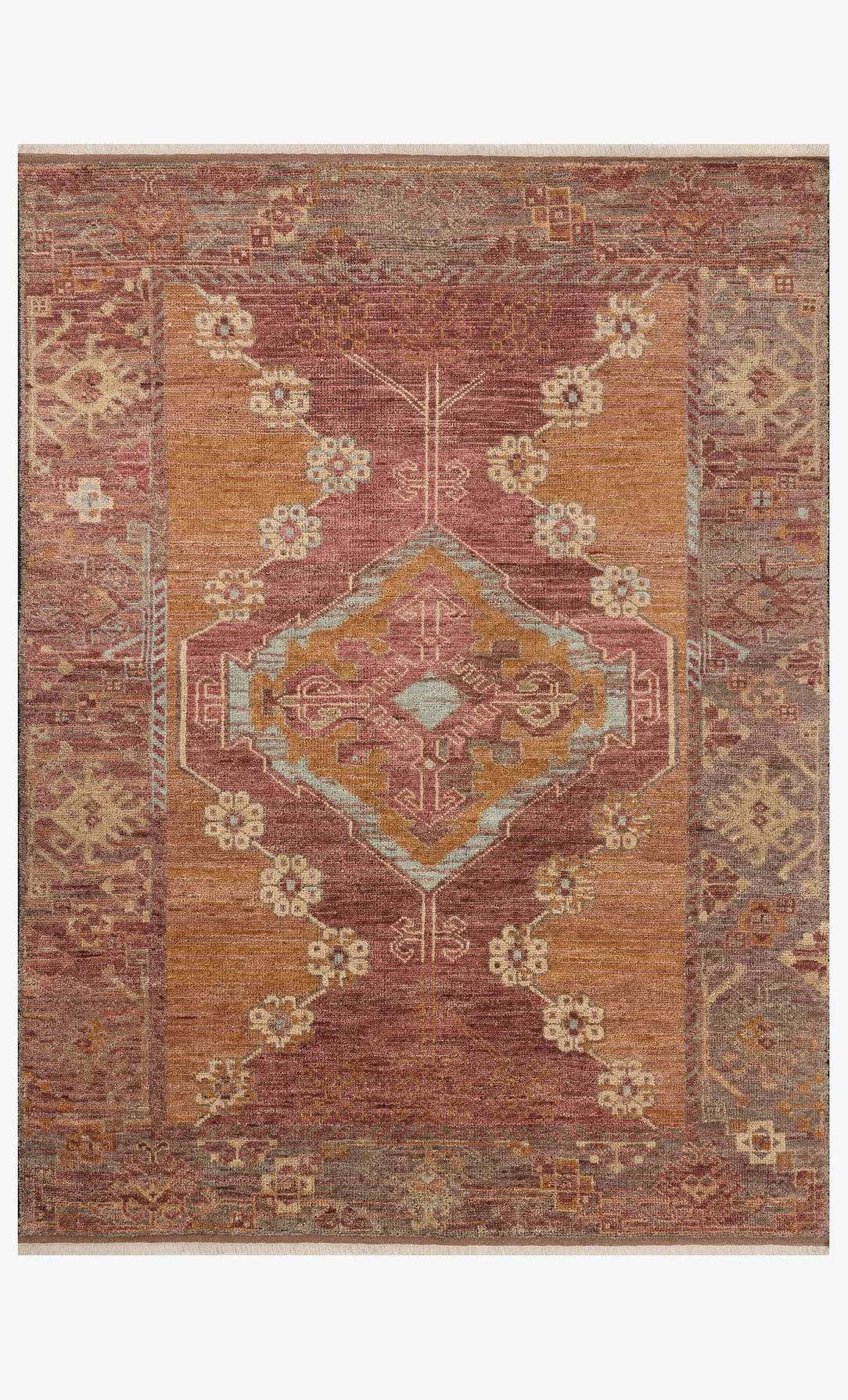 The Spice Rug (8'-6" x 11'-6") is a handcrafted rectangular area rug made from 100% wool, featuring a distressed vintage design with a central geometric medallion in muted rust, gold, and beige tones, decorative patterns, and earthy borders.