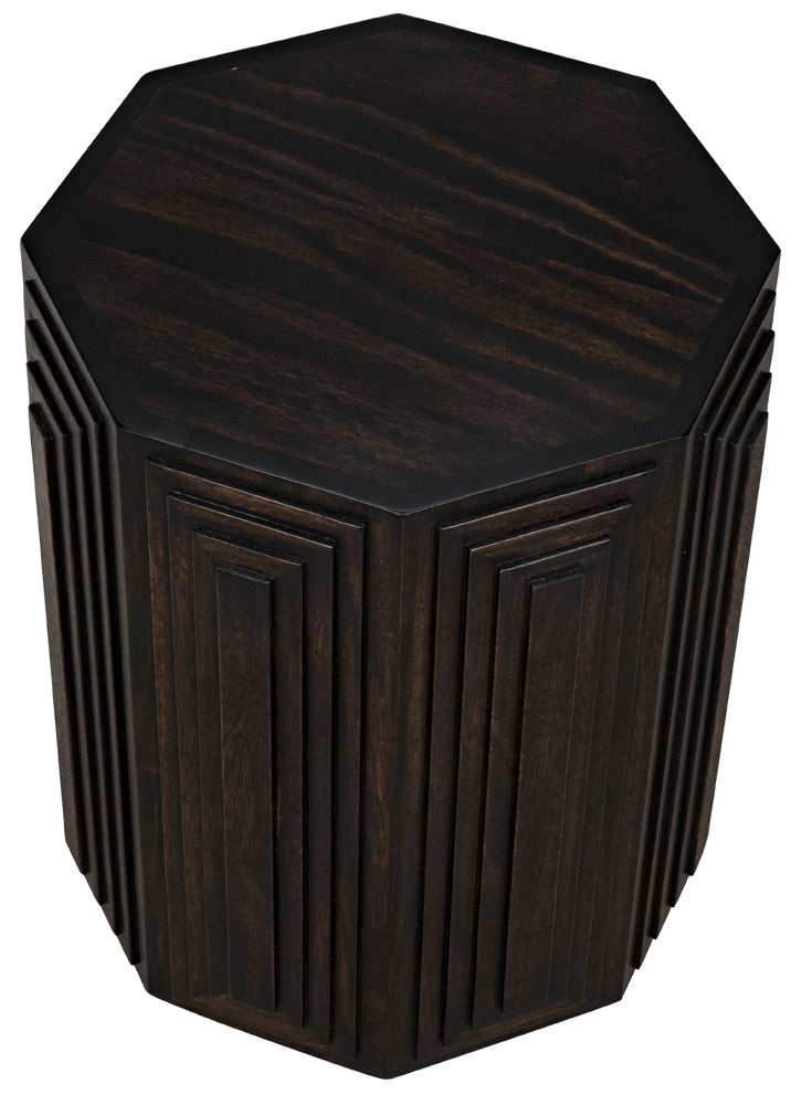 The Moore Side Table, Ebony, features a dark wooden octagonal shape with geometric raised rectangular side patterns. Its flat, smooth top displays a rich wood grain and sophisticated ebony finish.