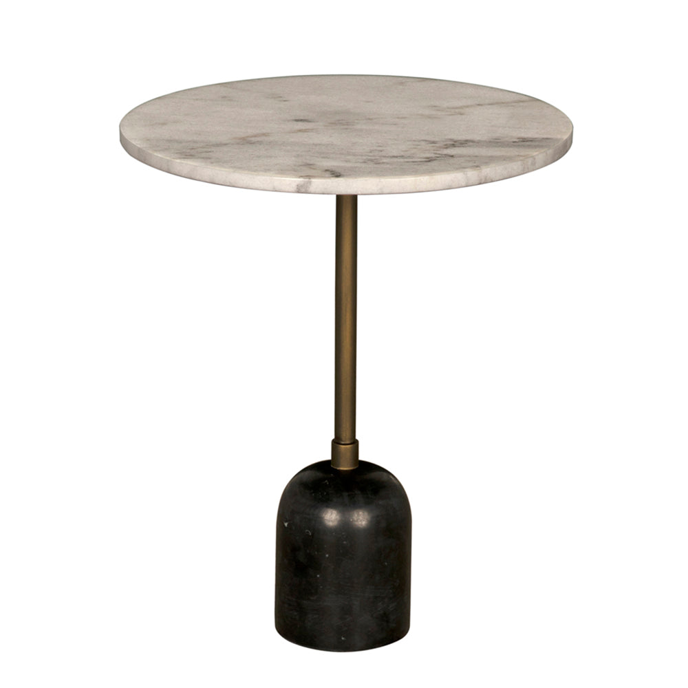 The Shantu Side Table with Stone Top showcases a round Bianco Crown marble surface, a slim aged brass stem, and a black base, offering a minimalist contemporary look that stands out elegantly in modern spaces.