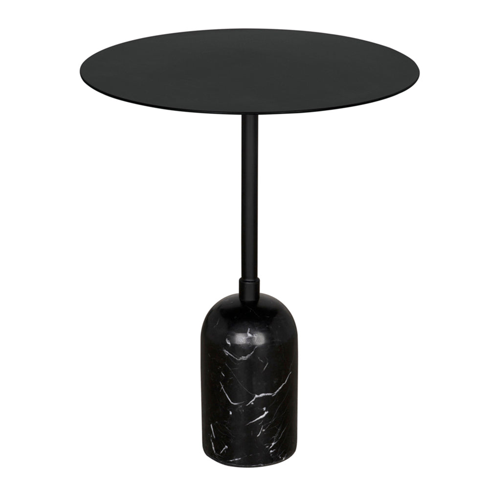 The Santosh Side Table features a modern design with a round black marble top, slim stem, sculptural iron frame, and a cylindrical black marble base.