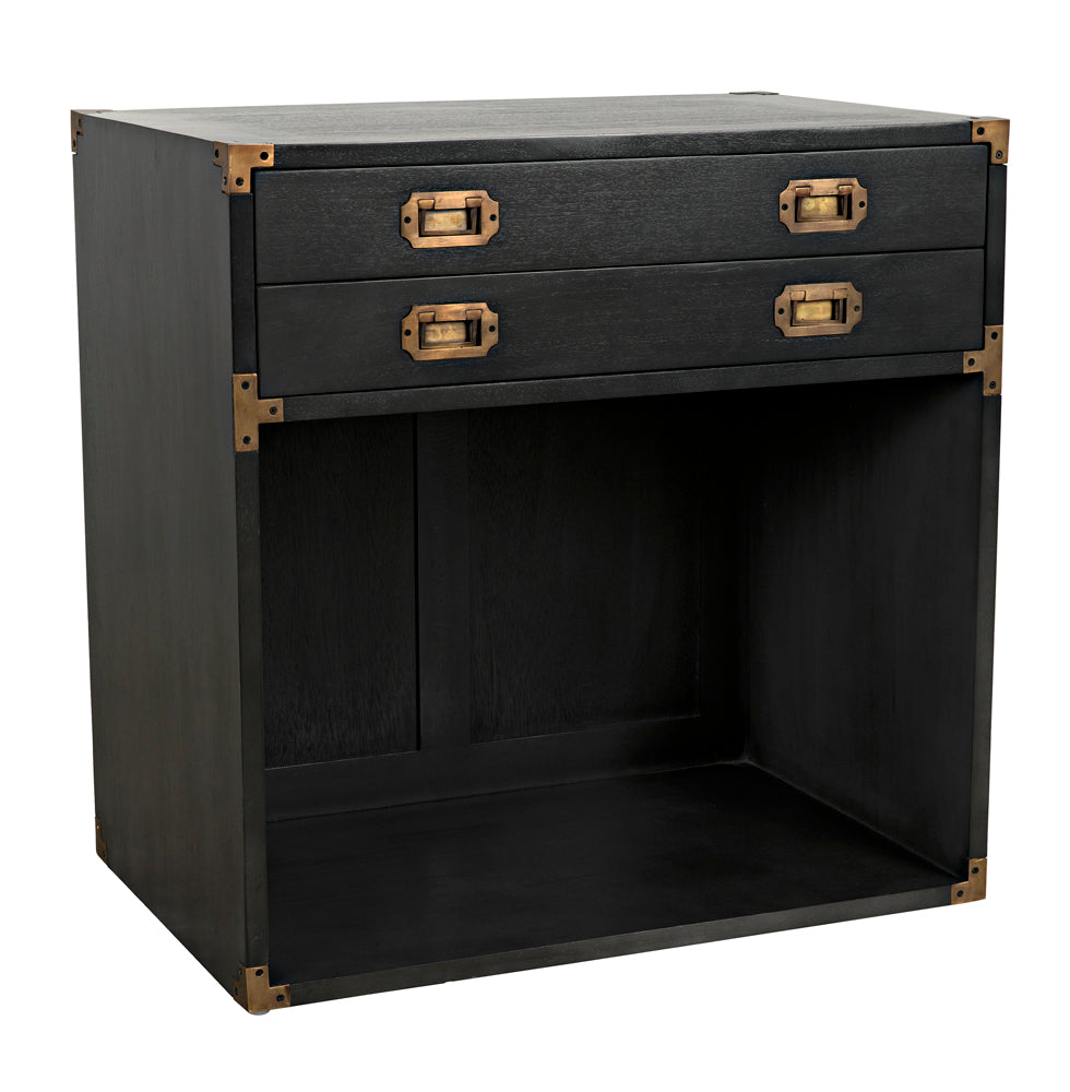 The Campaign Chest, Pale is a wooden side table with two drawers, brass handles and corner brackets, an open lower compartment, and vintage industrial styling reminiscent of a classic chest.