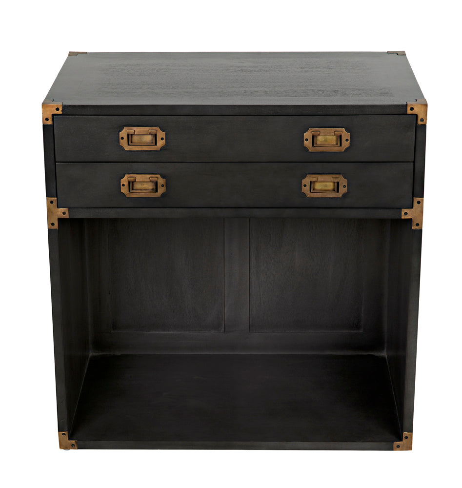 The Campaign Chest, Pale is a wooden side table in a light finish with two drawers featuring brass handles and corner accents, plus an open lower storage area.