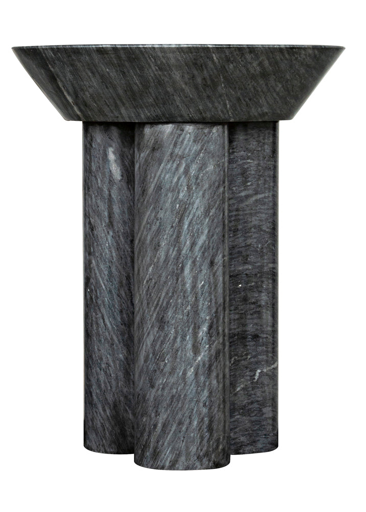 The Nox Side Table, B is a sculptural side table handcrafted from black marble, featuring a wide bowl-like top on four thick cylindrical legs. Its dark grey surface displays subtle, natural veining.