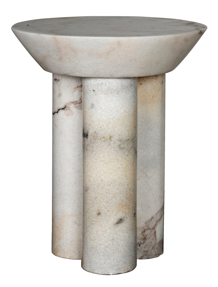 The Nox Side Table is a modern and elegant piece featuring a thick, marble-finished top with subtle natural veining and three cylindrical legs. Its smooth, light-colored surface adds a refined touch to any room.