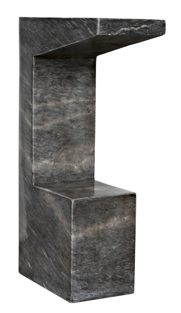 A modern gray stone chair with geometric, zigzag lines pairs perfectly with the Aero Side Table, B in black marble.
