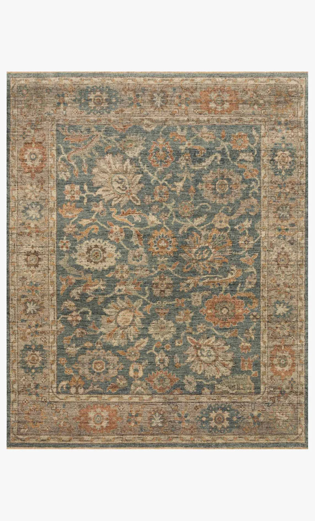 The Heirloom Rug Collection 8 x 10 features a hand-knotted wool design with a muted blue background, intricate floral and vine motifs in tan, rust, and cream, and a detailed multicolored border.