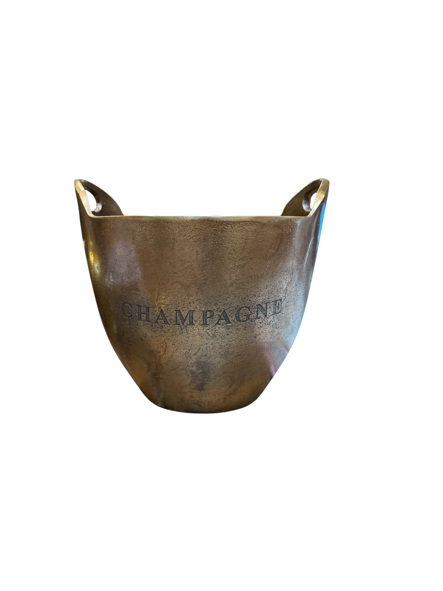 An aluminum champagne bucket with two handles and the word CHAMPAGNE engraved on the front is photographed against a white background; this versatile piece can also serve as a decorative pot or an elegant 11-inch planter for your favorite indoor plant.