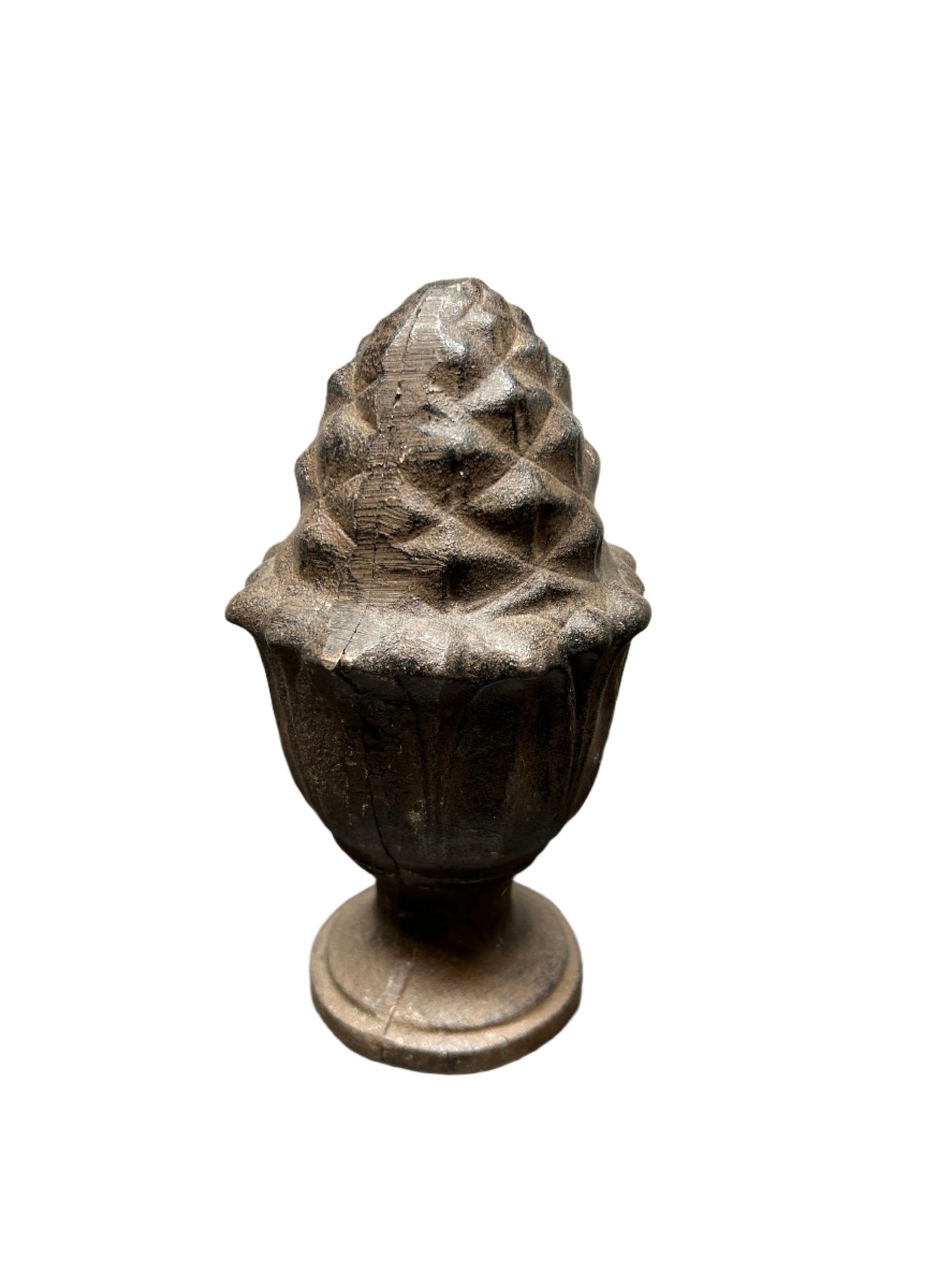 A Decorative Iron Acorn Finial with a rustic, weathered brown finish sits on a round pedestal base, styled as an ornamental accent and isolated on a white background.