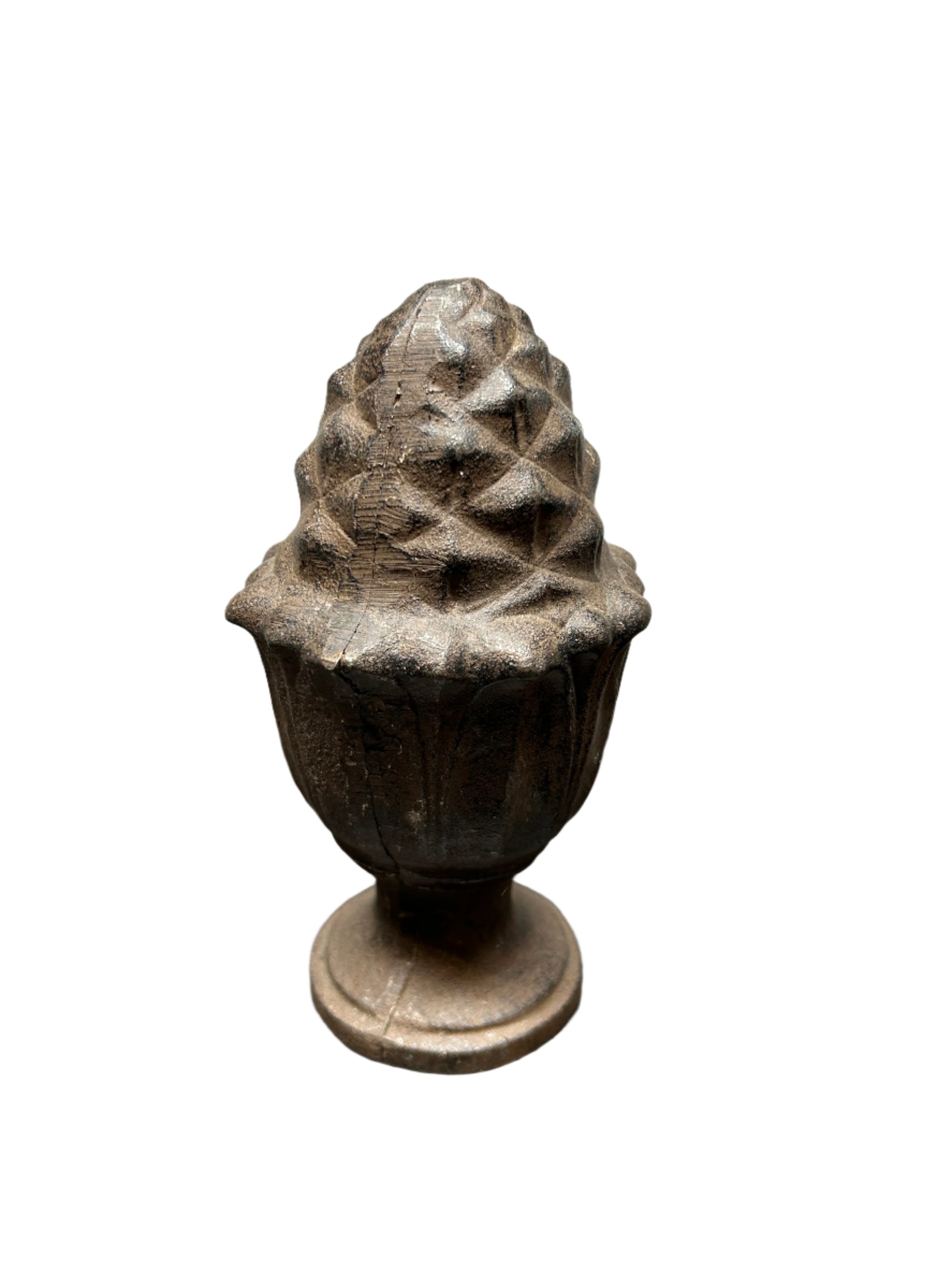A Decorative Iron Acorn Finial with a rustic, weathered brown finish sits on a round pedestal base, styled as an ornamental accent and isolated on a white background.