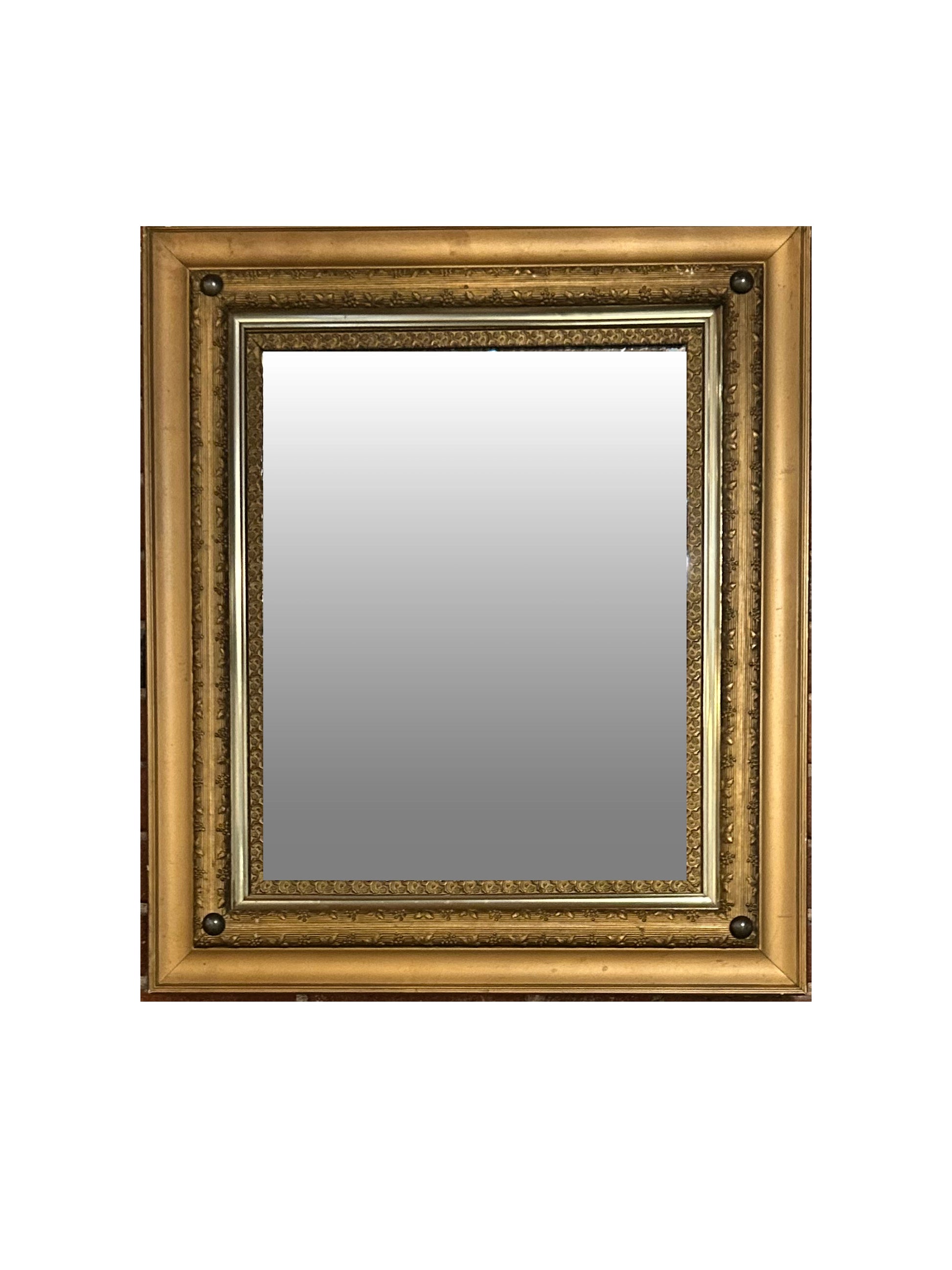 The Vintage Rectangular Gilt Mirror features a gold wood frame with elegant gilt detailing, set against a white background.