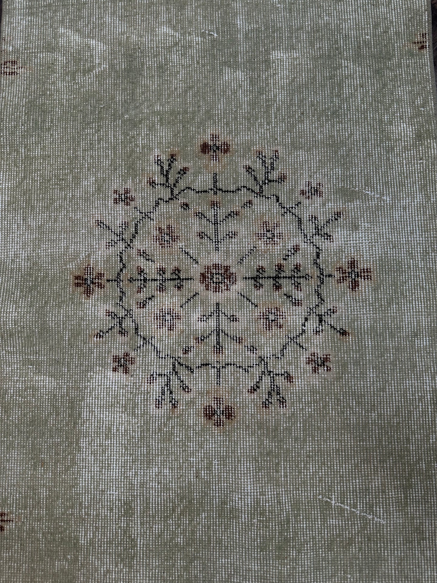 A close-up of the Vintage Turkish Runner 2x8 showcases its delicate floral design, evoking classic Turkish craftsmanship.