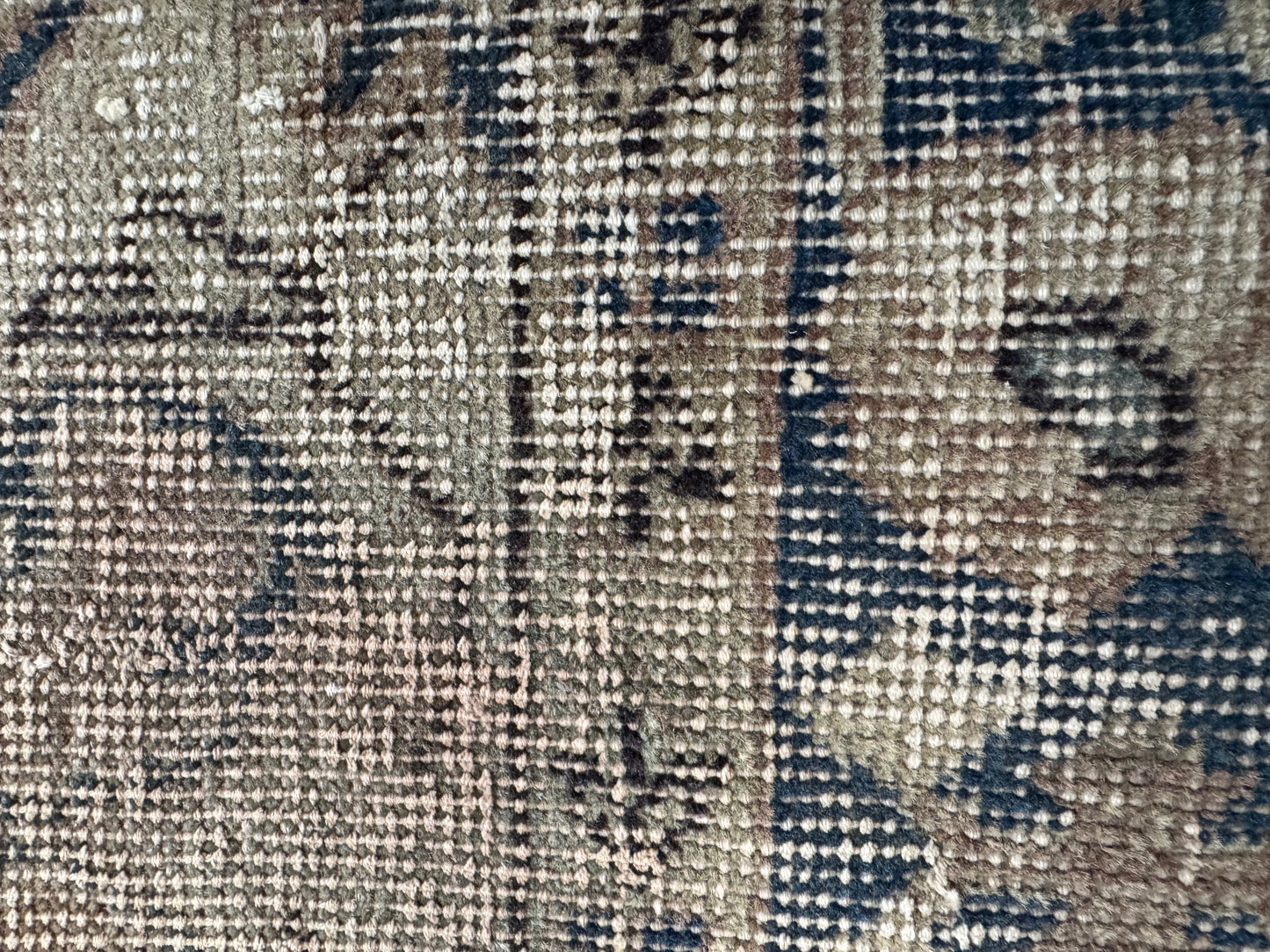 Close-up of the Vintage Distressed Turkish Runner Rug, a 2x6 area rug with woven geometric details in beige, blue, and brown tones.