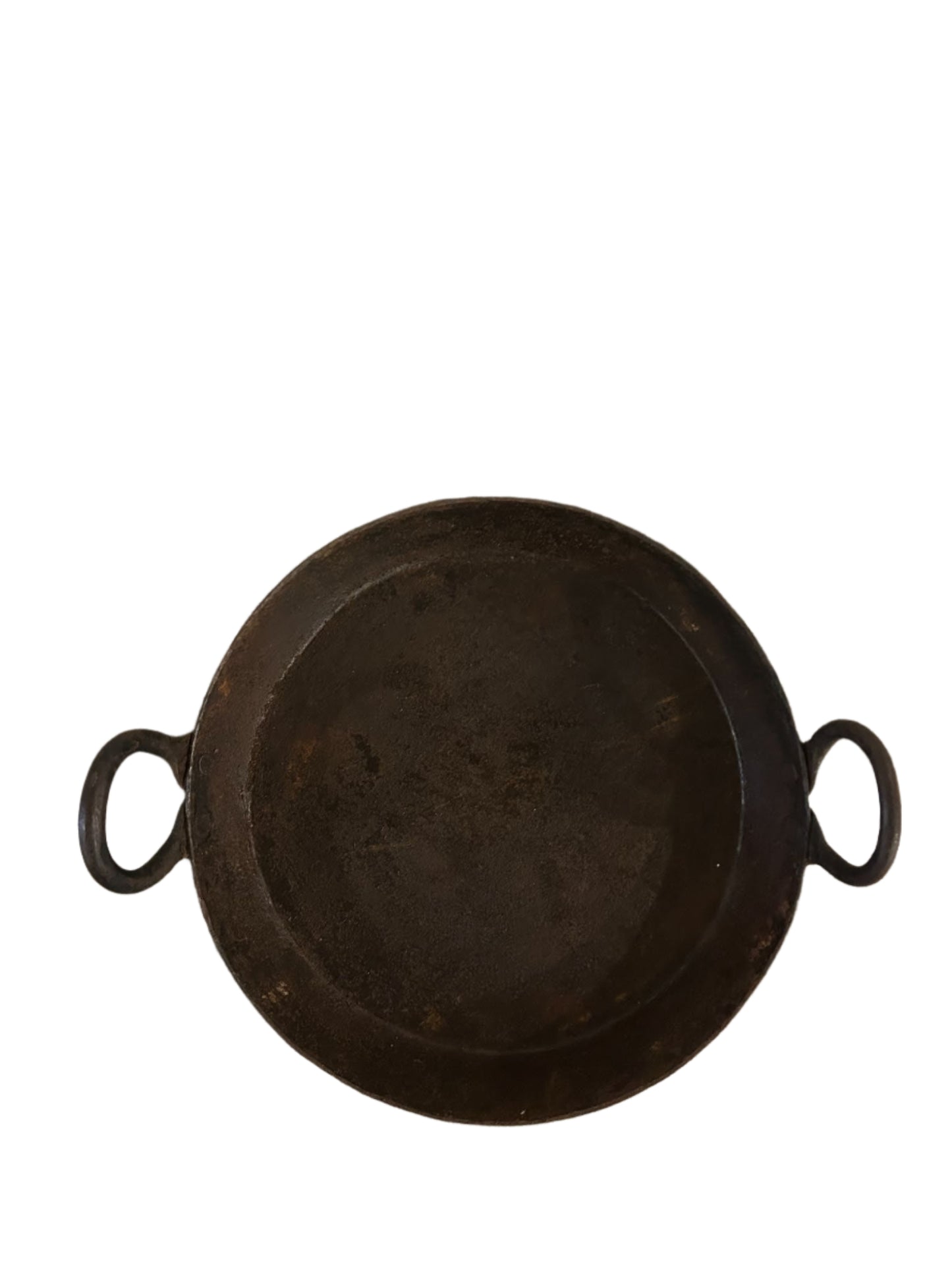 The Iron Skillet with Handles is a black, round iron griddle measuring 12"-15" wide and featuring two handles, shown against a white background.