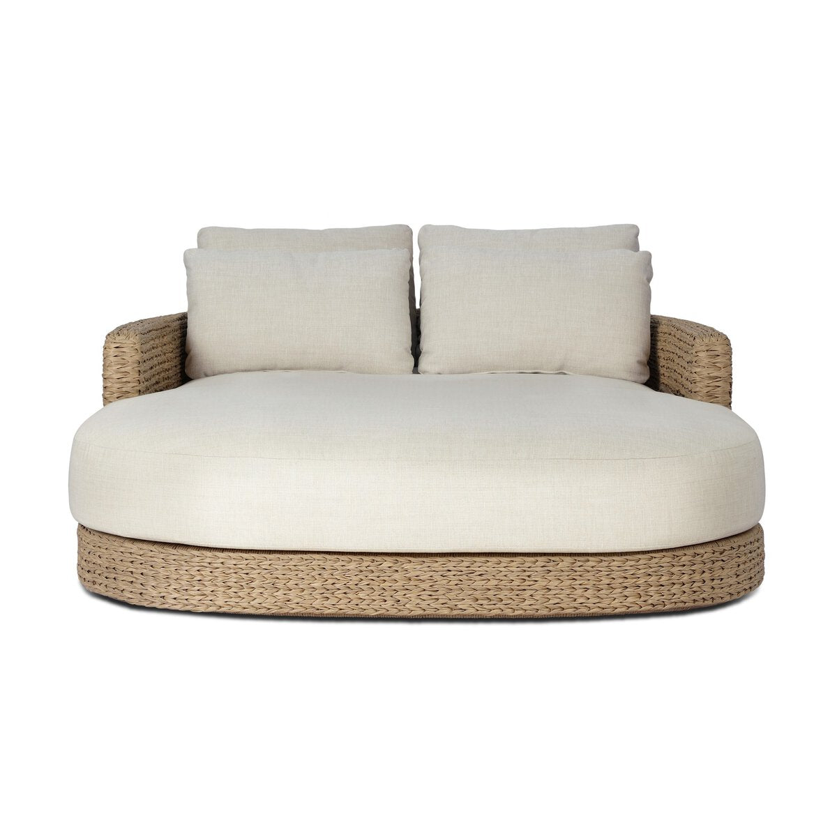 The Chaney Outdoor Double Chaise features a wide woven wicker base, light beige cushioned seat, and two matching back pillows. Measuring 62.00"w x 71.25"d x 32.75"h, it’s perfect for stylish lounging indoors or outdoors.