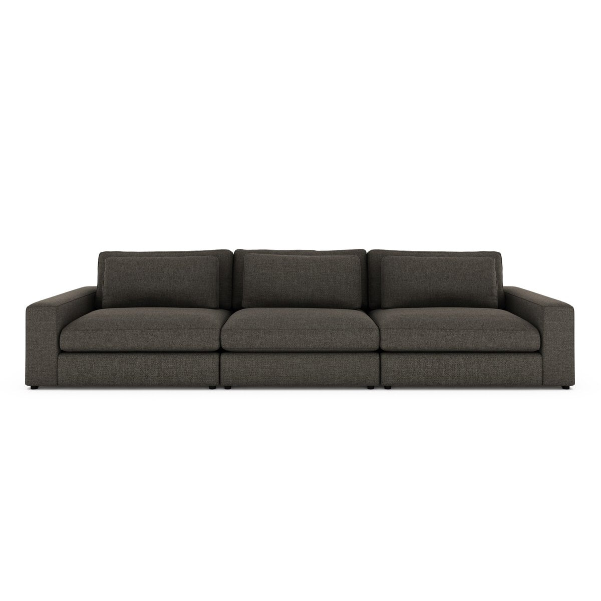 The 3-pc Modern Low Sectional features a dark gray design with wide armrests, low backrests, and plush cushions. Seen from the front on a white background, it pairs perfectly with an ottoman for added comfort and versatility.